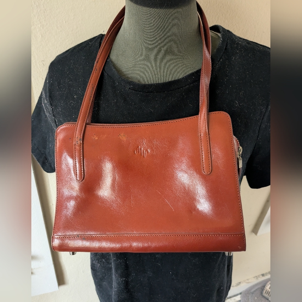 Monsac shoulder small bag 10" W X 7 2/2". 1 outside open pocket and one zippered